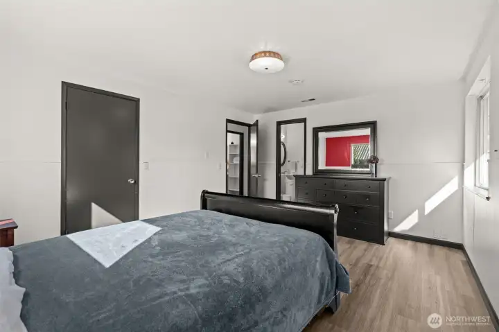 Primary Bedroom looking towards hallway and half bath