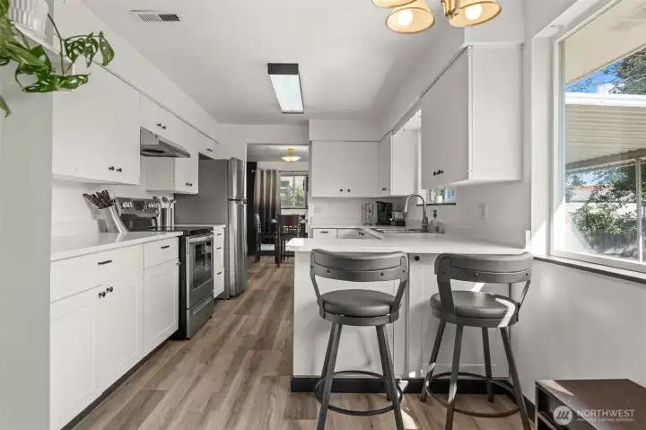 Kitchen from laundry area looking towards dining area