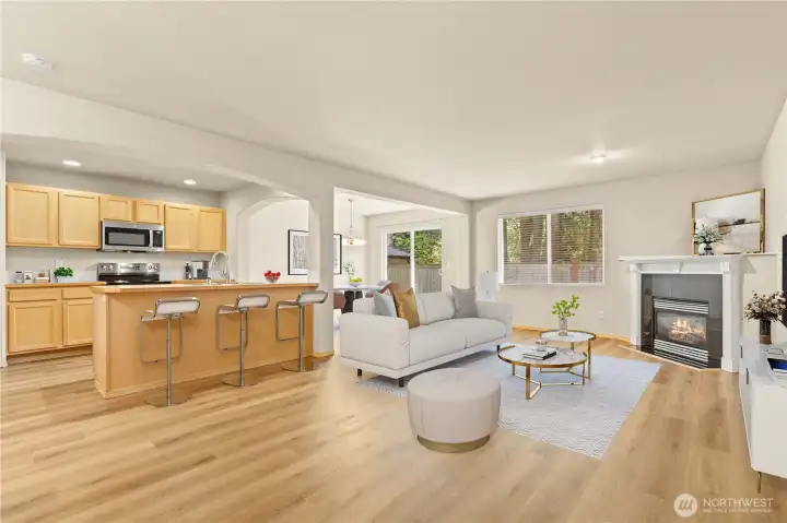 GREAT ROOM Concept w/Living, Dining and Kitchen. Brand New Laminate Floors throughout the entire main floor. Gas Fireplace. (Virtually Staged)