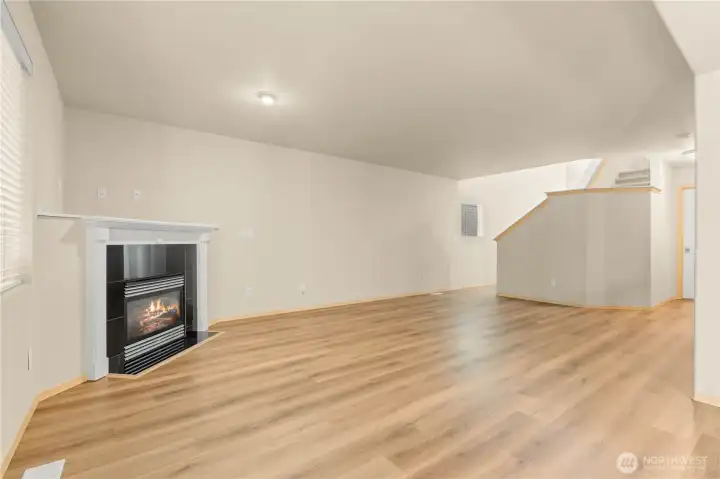 LIVING ROOM w/Lighting facing the fireplace that is directional.