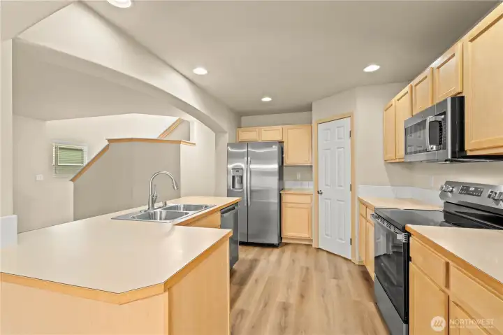 KITCHEN w/Brand-New Matching GE Stainless Steel Appliance Package: Glass Top Electric Range, Microwave, Dishwasher and French Door Fridge w/Ice & Water in the Door. You're all set!