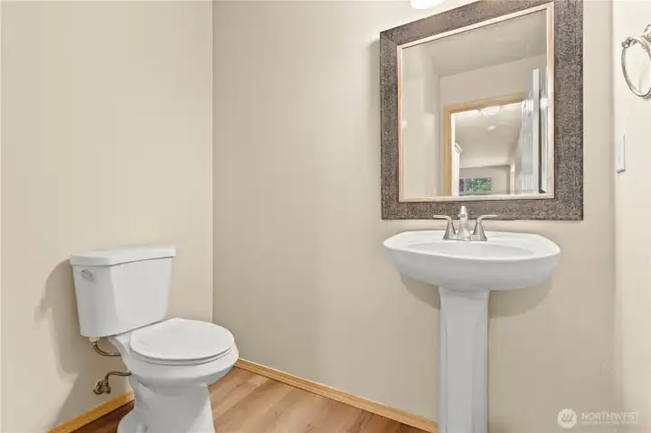 Half Bath w/Pedestal Sink and Laminate Floors