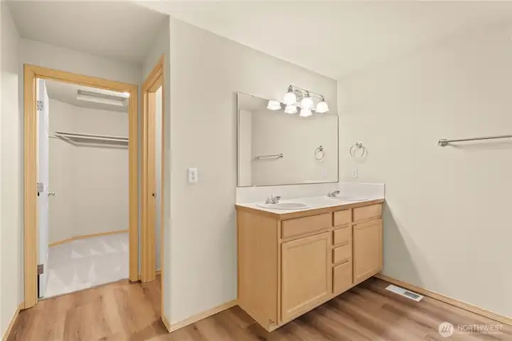 PRIMARY En Suite Bath facing the Walk-In Closet and Separate Water Closet.