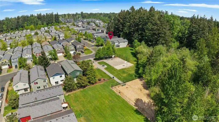 VIEW: Another view showing the Fenced Community Park. Arrow is on the Home. Notice all the lawn areas, too!