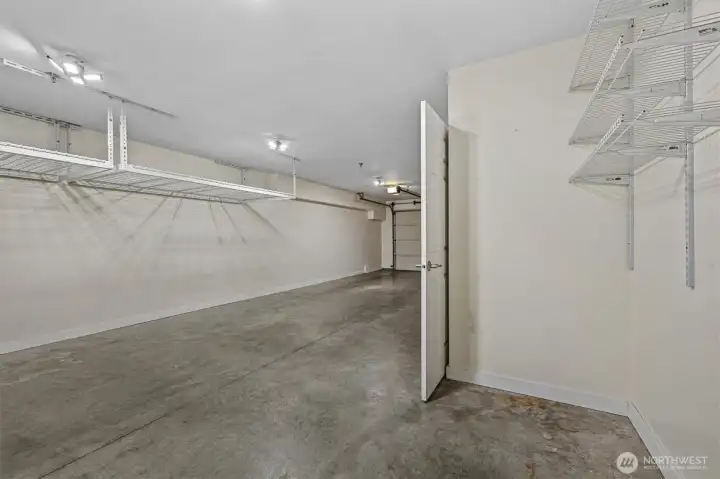 Large tandem garage with storage and built in shelving. Large tandem garage with storage and built in shelving.