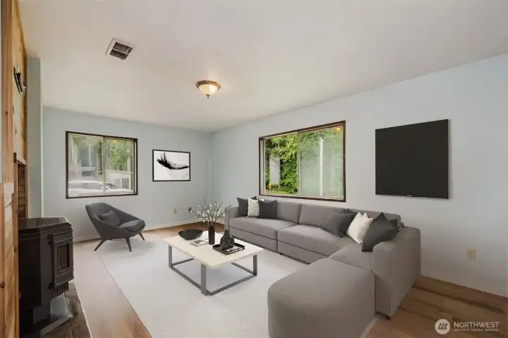 Gather and unwind in the spacious living room, where a warm pellet stove creates the perfect ambiance for Pacific Northwest evenings. Brand-new luxury vinyl plank flooring shines throughout, offering a fresh, modern touch. Virtually Staged. Gather and unwind in the spacious living room, where a warm pellet stove creates the perfect ambiance for Pacific Northwest evenings. Brand-new luxury vinyl plank flooring shines throughout, offering a fresh, modern touch. Virtually Staged.
