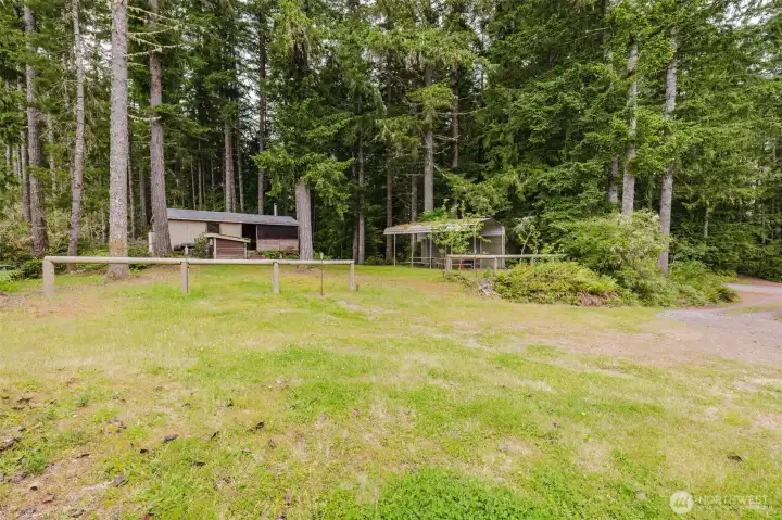 Tucked away across the driveway from the main home, this one-of-a-kind outbuilding has been transformed into the ultimate gathering space. Tucked away across the driveway from the main home, this one-of-a-kind outbuilding has been transformed into the ultimate gathering space.