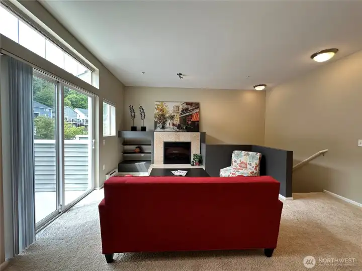 Designer colors pop with this unique styled floorplan. Great way to show off the fireplace, shelving and your favorite art or big screen Tv.