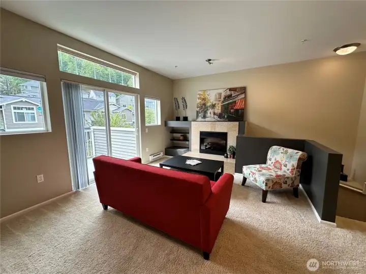 Gorgeous windows and slider provide plenty of natural lighting. The transom window above the slider is just so unique!