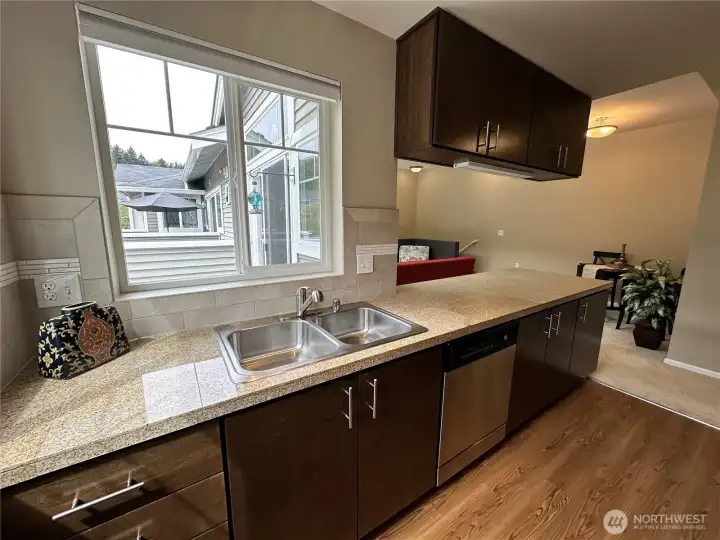 Tiled backsplash adds to the look but also easy to wipe clean. You can see out to the deck, top of the stairs, the dining area and living room all from the kitchen.