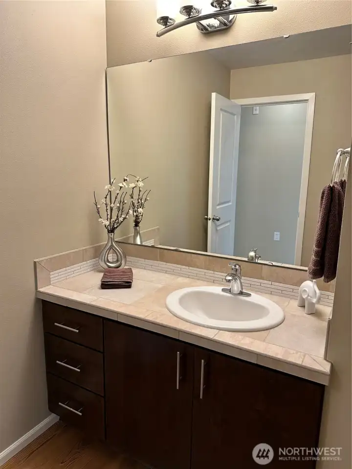 Main bath features tiled countertops and backsplash!