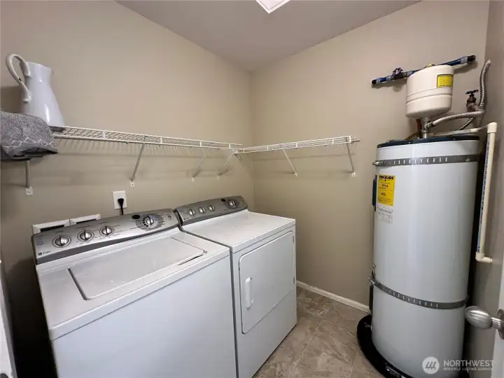 Laundry room with storage plus W&D stay adding value and convenience.