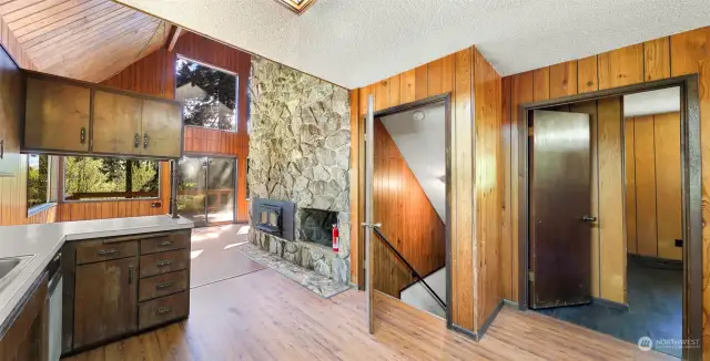 Stairs to basement, and  second bedroom  from entry to the kitchen and living space.