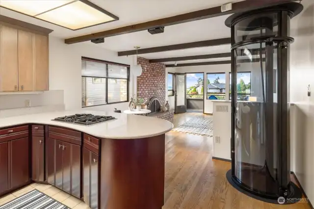 A fantastical kitchen is punctuated by granite counters, abundant storage, Stainless Steel appliances, and the opportunity, as always, to impart your own identity in its design. Note the pneumatic elevator that reaches all three levels.