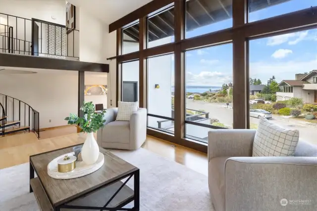 Whether you’re considering the view, filled with the wild waters of the Puget Sound and the rugged allure of the Cascade mountains, or are reveling in the company you invite into this airy space, the living room is sure to be a centering element of home life.