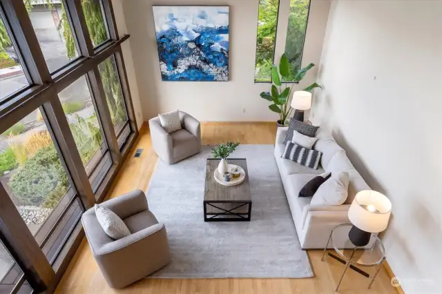 Exalt solo time by relaxing in the ground floor living room, a space filled with levity and air. Alternatively, show off the impressive vaulted ceilings, Pacific Northwest views, and personal touches of the space by entertaining friends and family alike.