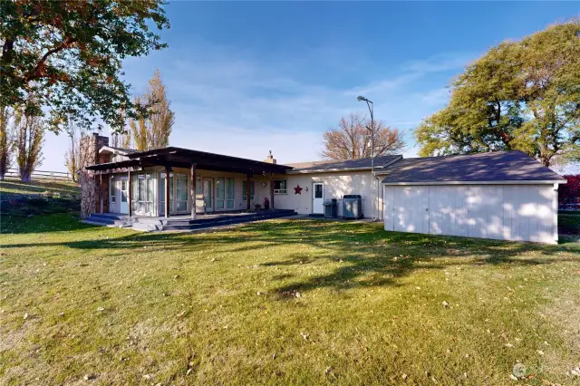 South view of home with extra storage rooms behind garage.