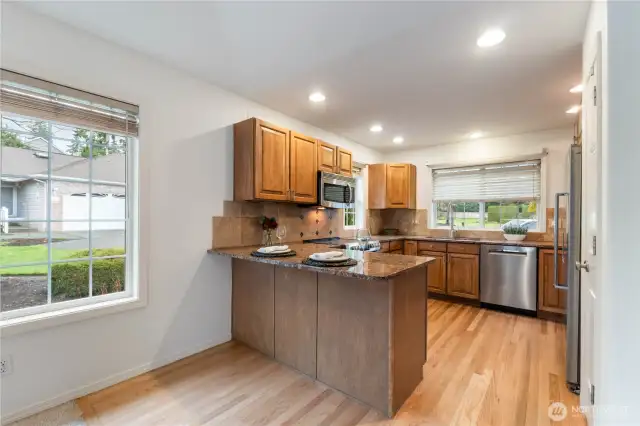 his wonderful kitchen offers granite countertops, stainless appliances and an eat bar for informal dining.