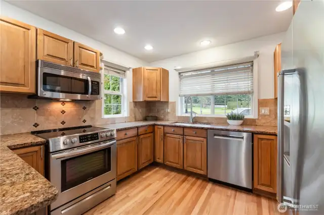 Beautiful hardwood floors make this kitchen sparkle.