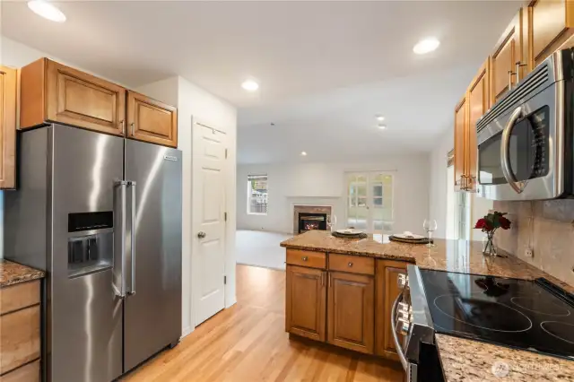 Never miss a conversation with guests as you prepare meals. Kitchen is open to central living room.
