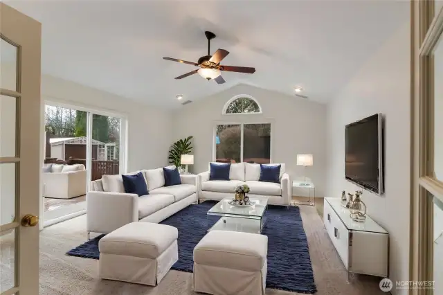 Just thru the French doors find this wonderful flex space that is situated right off the back deck and overlooks the hot tub and garden area.