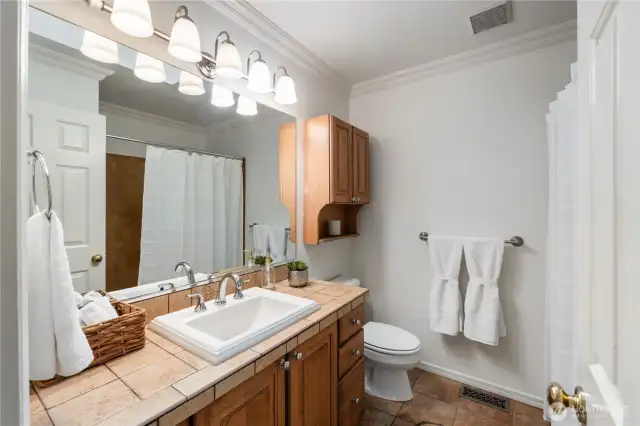 Main full bathroom has a skylight to fill this space with natural light.