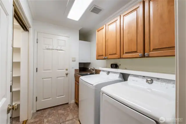 Utility room is located off of the garage entrance. The closet actually opens to a finished room!