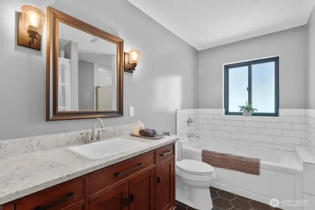 The spa-like bath has Italian tile floors and marble counters.