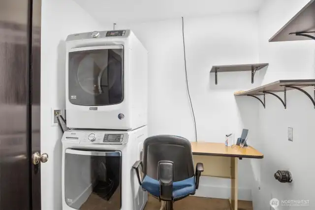 The office has a stack washer and dryer.