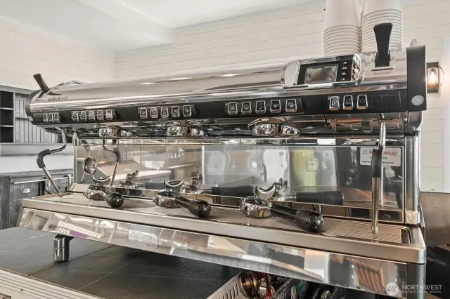 Beautiful high end Nuova Simonelli Aurelia Wave Volumetric espresso machine is included.