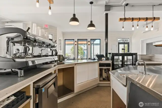 The espresso area has a cooler and wash sink.