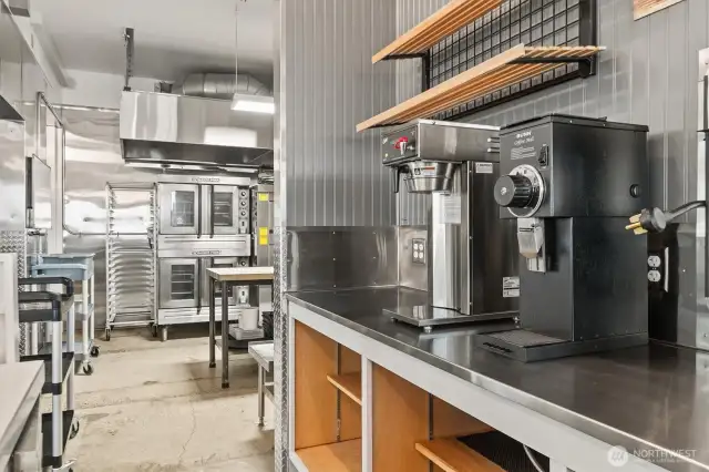 A commercial drip coffee maker and commercial grinder is included.