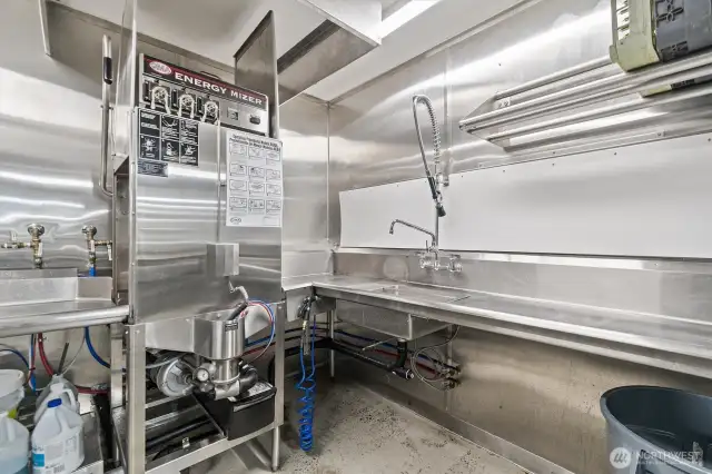 The dishwashing station has an Energy Mizer commercial dishwasher.