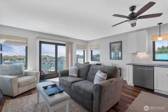 The luxurious apartment has hardwood flooring and upscale furnishings.