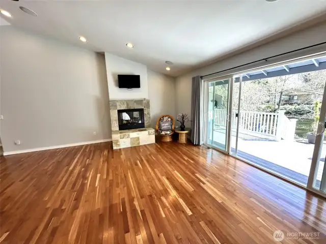 Large double sliders leading out to expansive covered deck with canal views