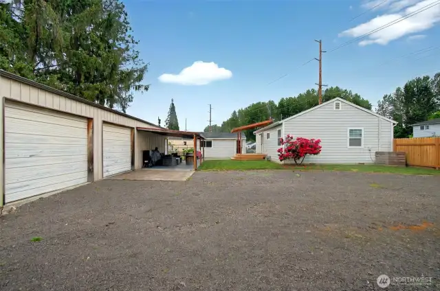 Offering main house, converted original garage into living space and a 1152 sq ft shop.