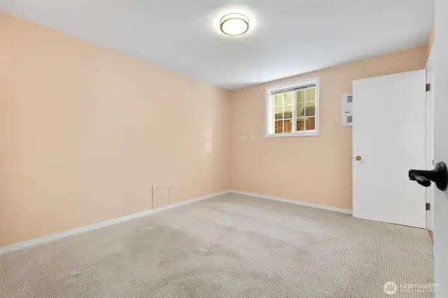 Main level bedroom off of bonus room