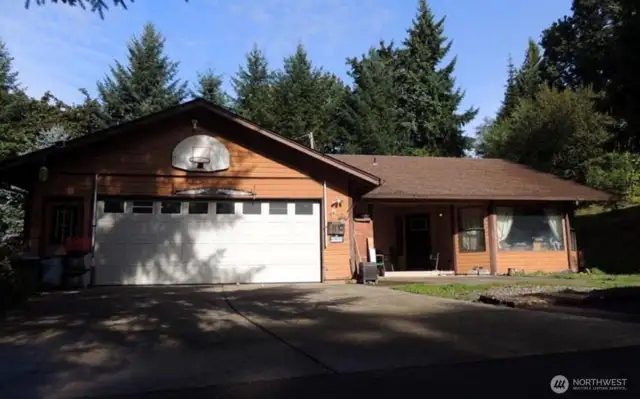 One level home on 40 acres, 2 bedrooms, 2 bathrooms, outdoor spaces with a barn