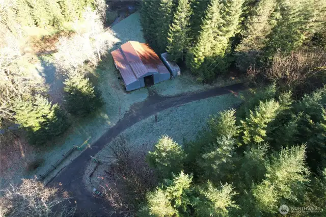 Barn area at the beginning of the driveway: 818 NW 349th St, La Center Home with 40 acres, forestry designation, asphalt driveway, 2 bedrooms, 2 baths, oversize garage with a barn