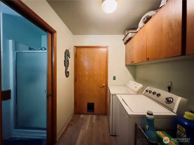 Off of the garage laundry room(bathroom entry to the left) of the single level home at 818 NW 349th St, La Center WA in Clark County.