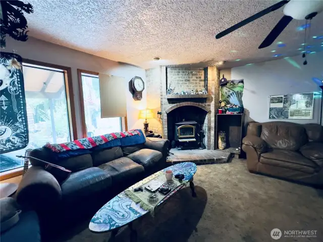 Family room (great room since it flows to the dining area, kitchen and outdoor patio area) of the single level home at 818 NW 349th St, La Center WA in Clark County.