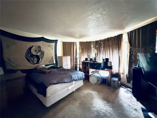 Formal living room (currently used as a bedroom) of the single level home at 818 NW 349th St, La Center WA in Clark County.
