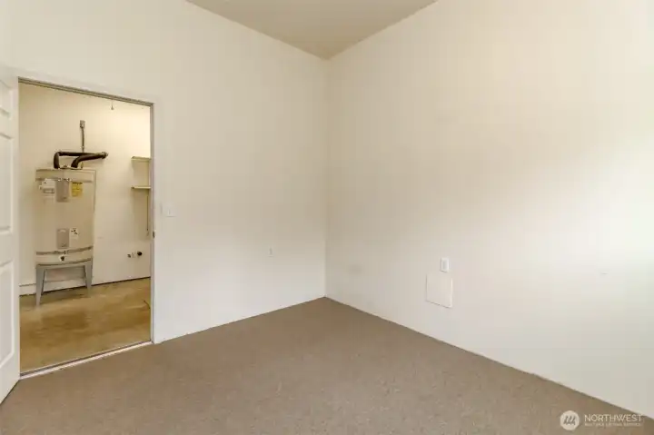 Office space in garage with exterior door.