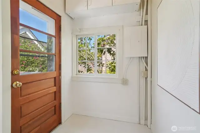 Mudroom off kitchen leading to deck and backyard
