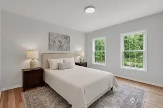 AI generated photo. Seller will replace the downstairs dining room with an additional bedroom by adding a wall/door.