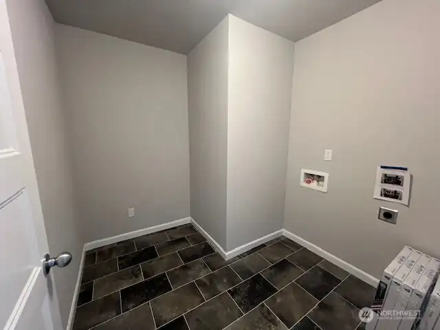 LAUNDRY ROOM 2ND FLOOR WITH NEW WASHER AND DRYER IN THE GARAGE STILL IN BOXES