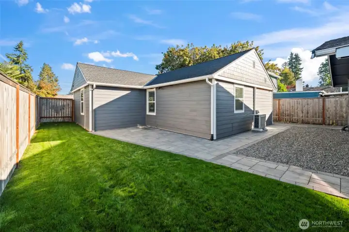 Detached 4 car tandem garage to the left, house is on the right. Brand new pavers, new work, landscaping, siding, exterior paint.