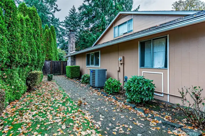 Side of house. Heat pump w/ A.C. and gas forced air heat
