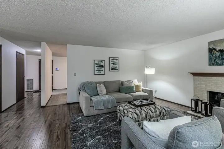 Family room with view of door to the upstairs loft on the left, and garage door straight ahead