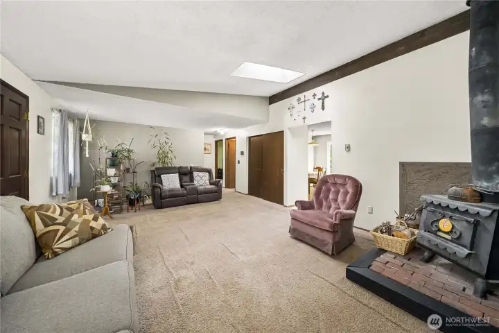 Living Room with Ductless HP Mini Split for heating and air conditioning.